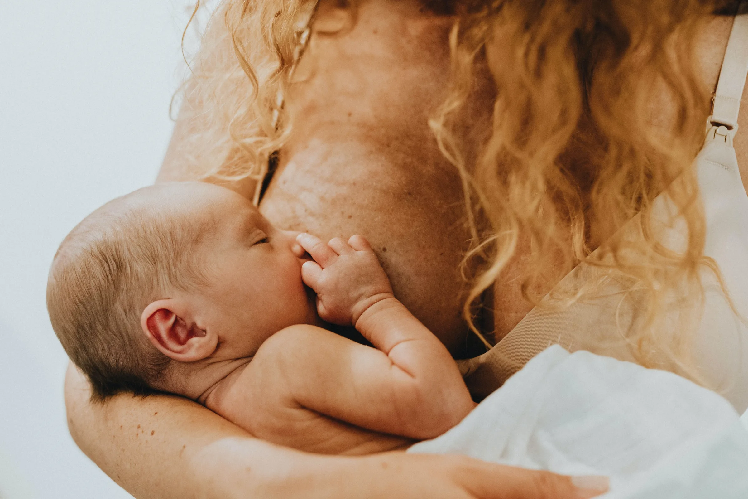 mother breastfeeding her baby